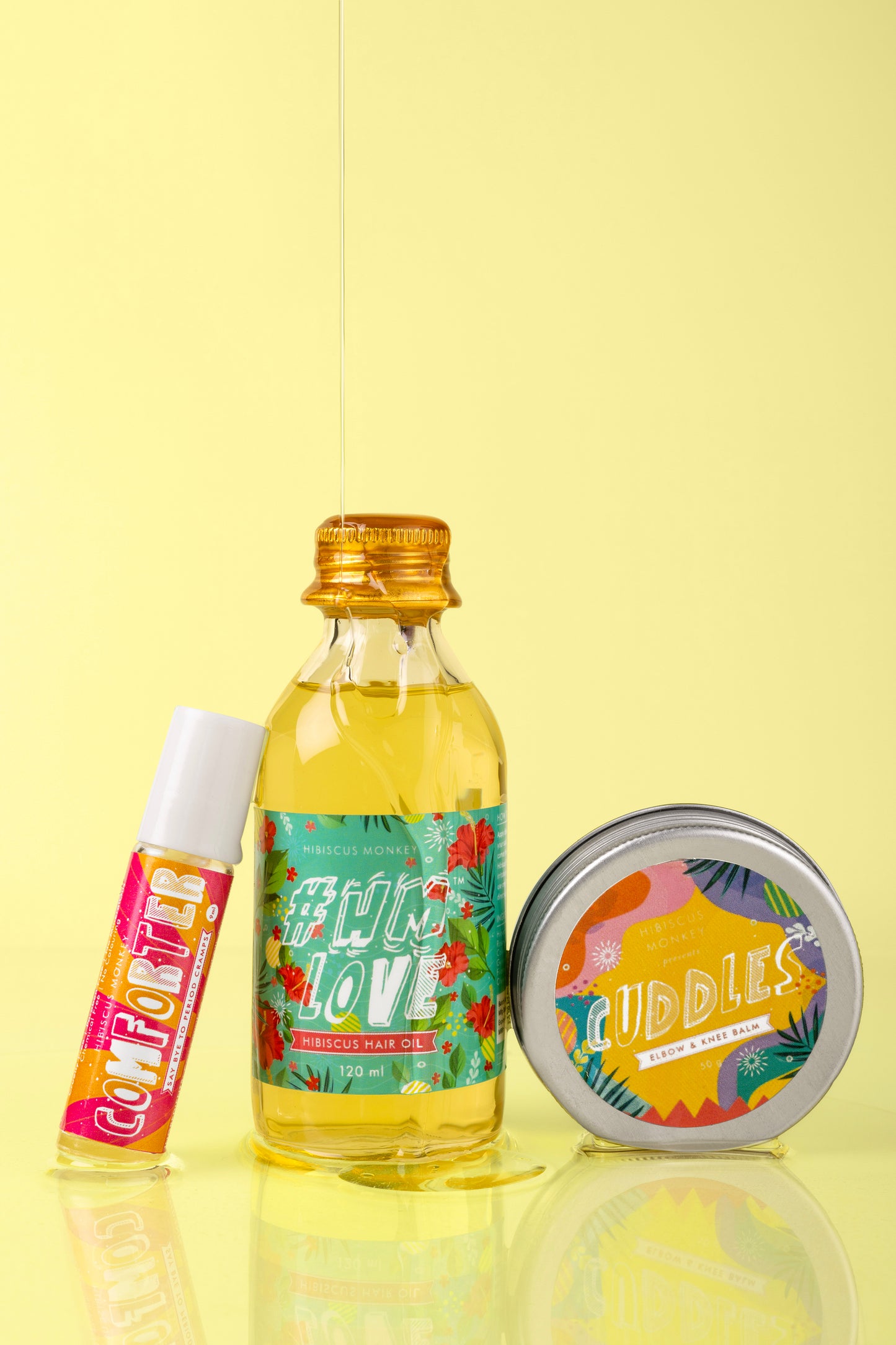 Hibiscus Monkey Bundle contains hair oil, elbow and knee balm, period cramp reliever